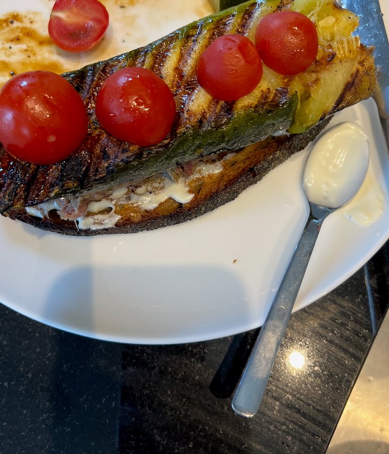 Grilled zucchini sandwich with cherry tomatoes on toasted bread